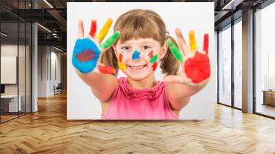 smiling little girl with hands painted in colorful paints Wall mural