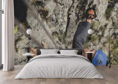 Male Alpinist Climbing a Rock Wall mural