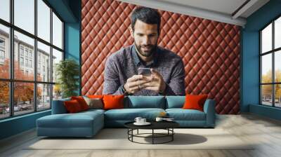 Man Typing on Smartphone Wall mural