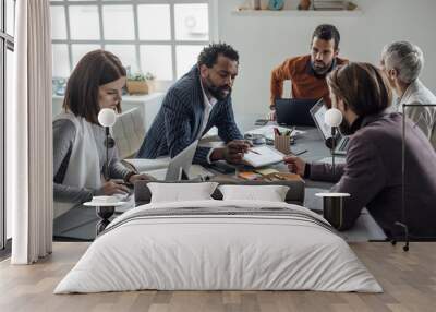 Multiethnic Group of Businesspeople on a Meeting Wall mural