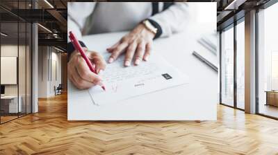 Teacher Grading Exam Paper With A Wall mural