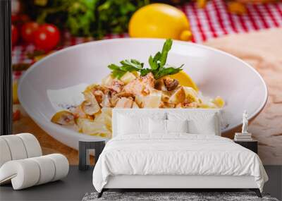 Pasta with salmon and mushrooms on white plate. Close up Wall mural