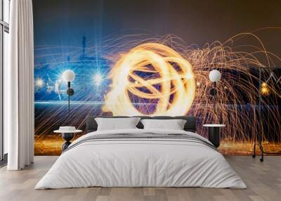 Long exposure photography with the fire ball at night Wall mural