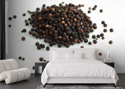 Pile of black peppercorns isolated on white Wall mural