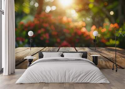 Beautiful blurred background, an empty wooden table in the garden with sunlight and bokeh effect of light Wall mural