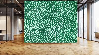 Abstract white floral pattern on green fabric as background. Wall mural