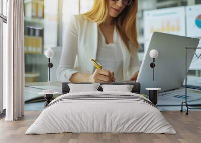 Professional Woman Reviewing Documents and Brainstorming Ideas Wall mural