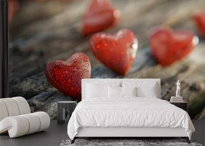 Red wooden hearts on an old wooden table. Wall mural