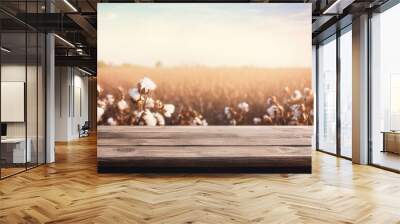 Empty rustic old wooden boards table copy space with cotton plants and white flowers in background. Product display template. Generative AI Wall mural