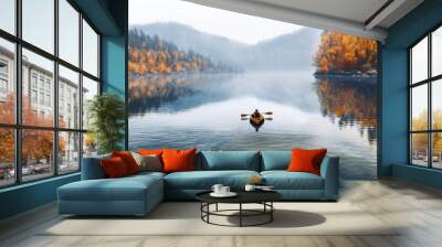 Person rowing on a calm lake in autumn, aerial view only small boat visible with serene water around - lot of empty copy space for text. Generative AI Wall mural