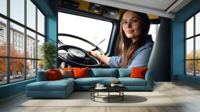 Woman sitting behind steering wheel of bus or truck. Female large vehicle driver concept. Generative AI Wall mural