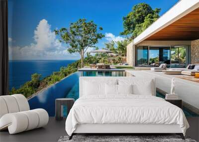 Luxurious infinity pool overlooking tropical ocean at a modern villa Wall mural