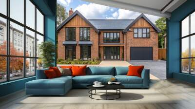 Modern brick home with slate roof and large driveway on sunny day Wall mural