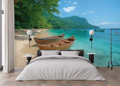 Traditional wooden boats resting on a secluded tropical beach paradise Wall mural