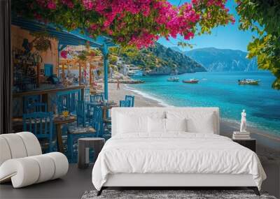 Turquoise sea water and boats on a sunny day at a greek beach with a cozy restaurant Wall mural