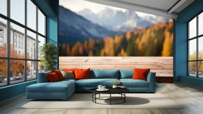 Wooden table top on blurred background of autumn color landscape in dolomites - for display your products Wall mural