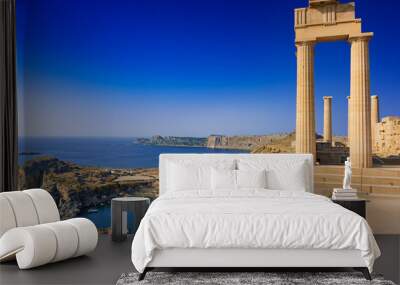 View of St. Paul´s bay and ancient temple of goddess Athena on acropolis of Lindos (Rhodes, Greece) Wall mural