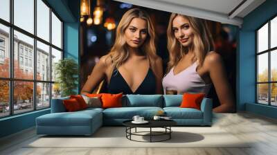 2 Beautiful Girls at the Bar Drinking some Cocktails. Elegant & Sexy Dress. Wall mural