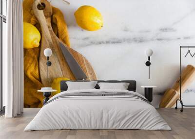 Fresh Lemons with kitchen utensils on a marble surface Wall mural