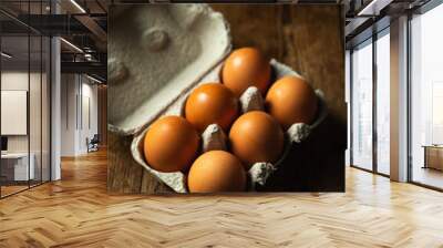 packaging of six eggs on wooden table Wall mural