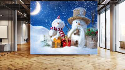 snowman in a snowdrift with gifts for christmas and new year Wall mural