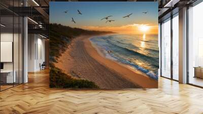 High angle view of pristine beach at sunset with gente waves and seagulls flying Wall mural