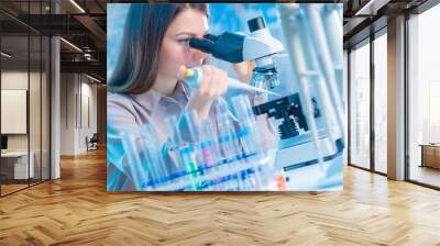  laboratory assistant with a pipette and a microscope in the laboratory Wall mural