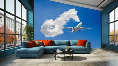 White passenger airplane flying in the sky amazing clouds in the background Wall mural