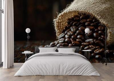 Roasted coffee beans pouring out of a burlap bag onto dark wood, vintage ambiance, empty space on both sides Wall mural