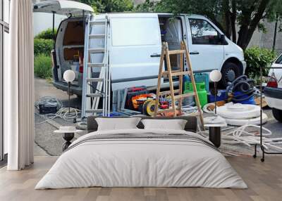 Air conditioning equipment and tools on the street during cleaning the van. Wall mural