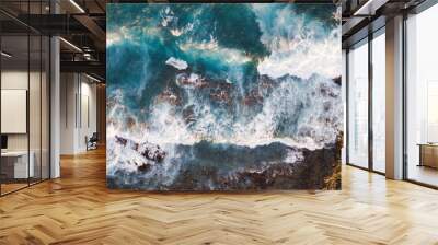 Atlantic ocean with strong swell beating against the walls of a rocky cliff, blue rough sea with big waves with foam crashing against the rocks, south of Tenerife, Canary island Wall mural