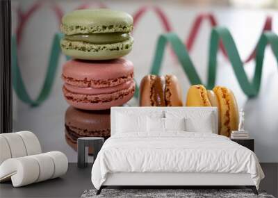 Close up of different pastel colored macaron cakes filled with cream. Culinary and cooking concept. Tasty colorful macarons Wall mural