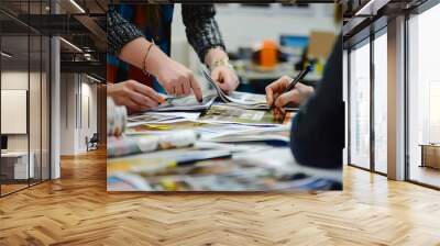 business team collaborating on magazine layout in modern office brainstorming and planning Wall mural