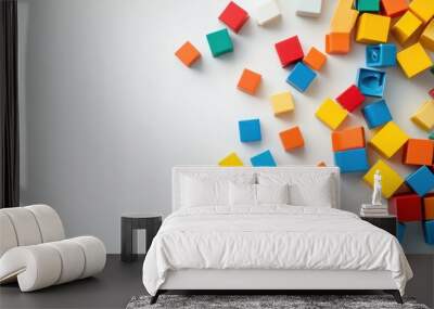 colorful toy building blocks scattered on white surface creative play Wall mural