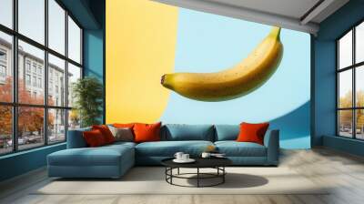 single ripe banana floating in surreal pastel space casting soft shadow Wall mural