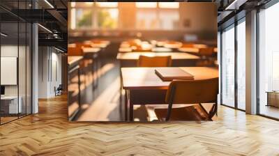 Empty school classroom without young student. Blurry view of elementary class room no kid or teacher with chairs and tables in campus Wall mural