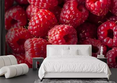 Full frame closeup of fresh ripe red healthy raspberries in pile on stall Wall mural