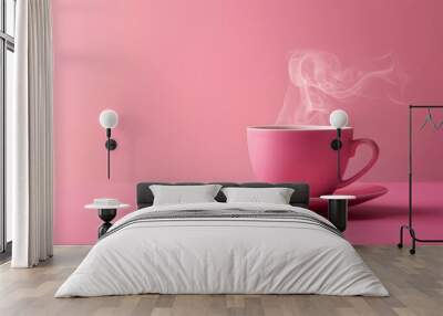 Pink cup with steam, coffee or tea on pink background. Wall mural