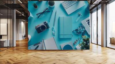 top view of work space photographer with digital camera, a blue notebook with notepad desk Wall mural