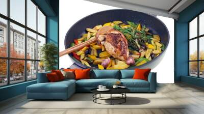 fried chicken & vegetables in a black pan isolated on white Wall mural