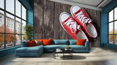 red sneakers on wooden background. Concept of Sport, Work out, Training. Toned image. Wall mural