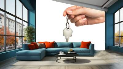 Hand holding a key with a white keychain, isolated on white background. Perfect for real estate or security related concepts. Wall mural