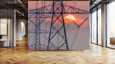 High voltage pole clouds and the sun are falling, Electricity transmission pole. Wall mural