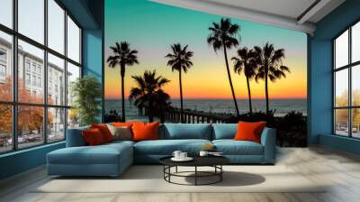 Palm trees and pier at sunset on Los Angeles Beach. Vintage processed. Fashion tropical beach concept. Wall mural