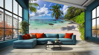 Paradise beach with coco palms and tropical sea. Fashion travel and tropical beach concept. Wall mural