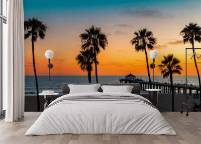 Sunset beach with palm trees in Manhattan Beach, California. Fashion travel and tropical beach concept. Wall mural