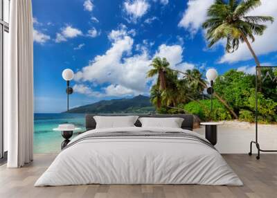 The beach on Paradise Island. Tropical beach with coconut palms, rocks and turquoise sea in Seychelles island. Wall mural