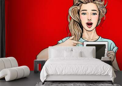 Attractive sexy young girl pointing finger on tablet in comic style. Digital advertisement female model showing the message or new app on device. Wall mural