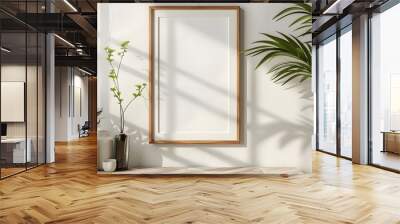 Photo frame with copy space image for decorating set against a white wall on a bright spring day Wall mural