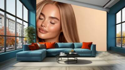 A beautiful woman showcases glowing skin and long, flowing hair against a soft, neutral background. Wall mural